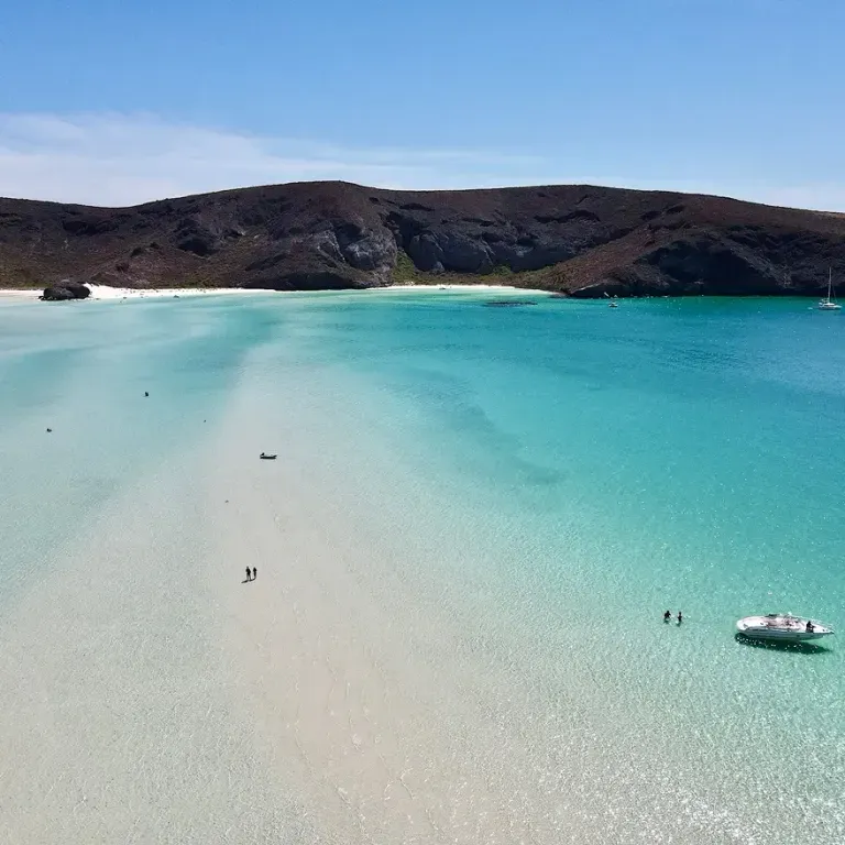 shoreline with clear waters and white sands