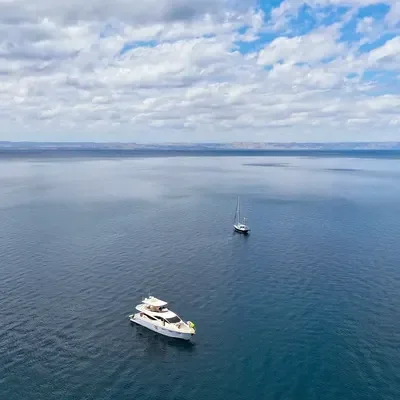 yacht with a sailboat