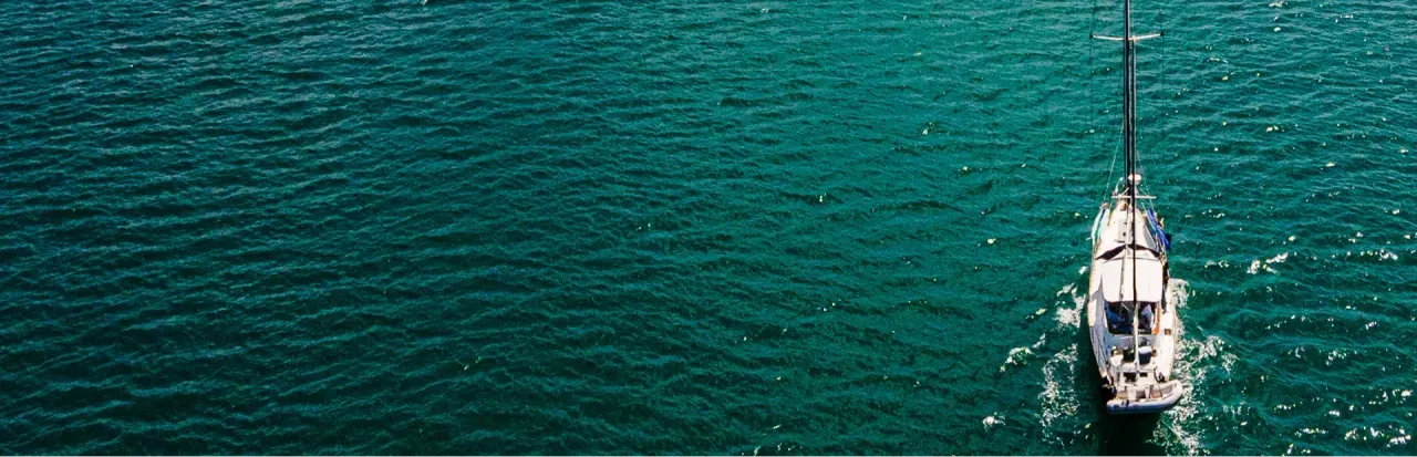 sailboat sailing towards open sea