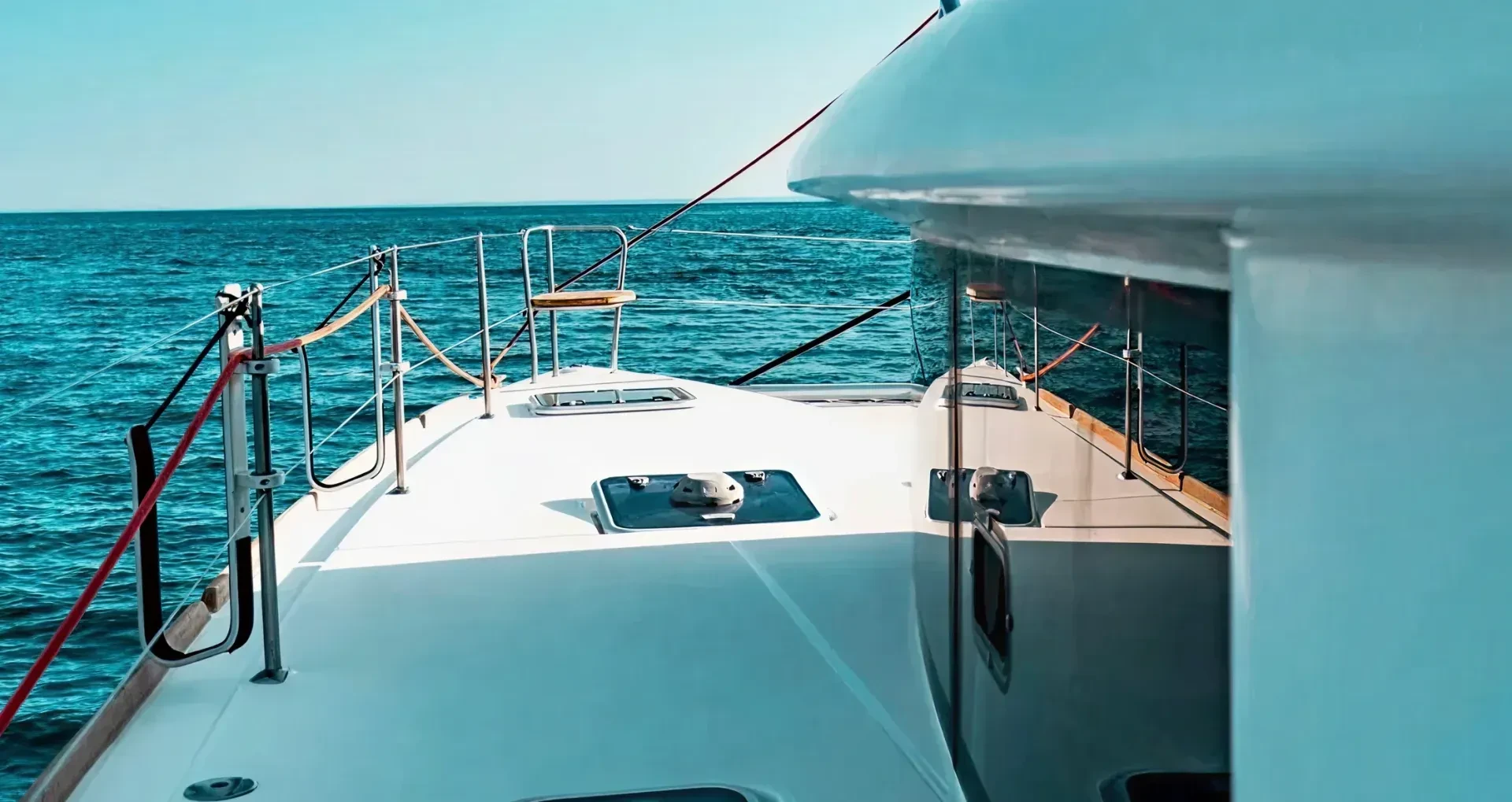 Overboard view of catamaran sailing the sea