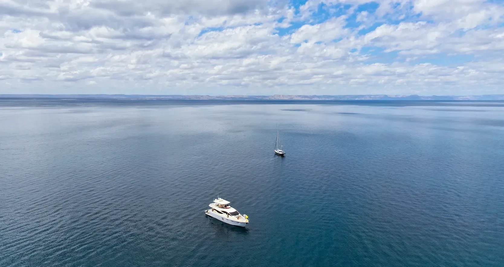 yacht with a sailboat