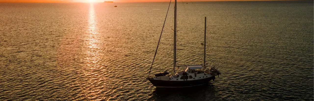 sailboat in the sunset banner image