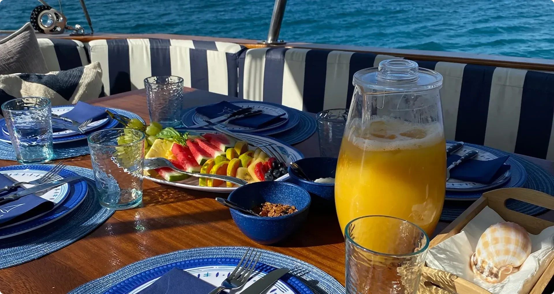 Food and orange juice ready at table